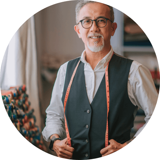 Smiling older man wearing glasses and a vest, representing affordable eye care with VSP Individual Vision Plans.
